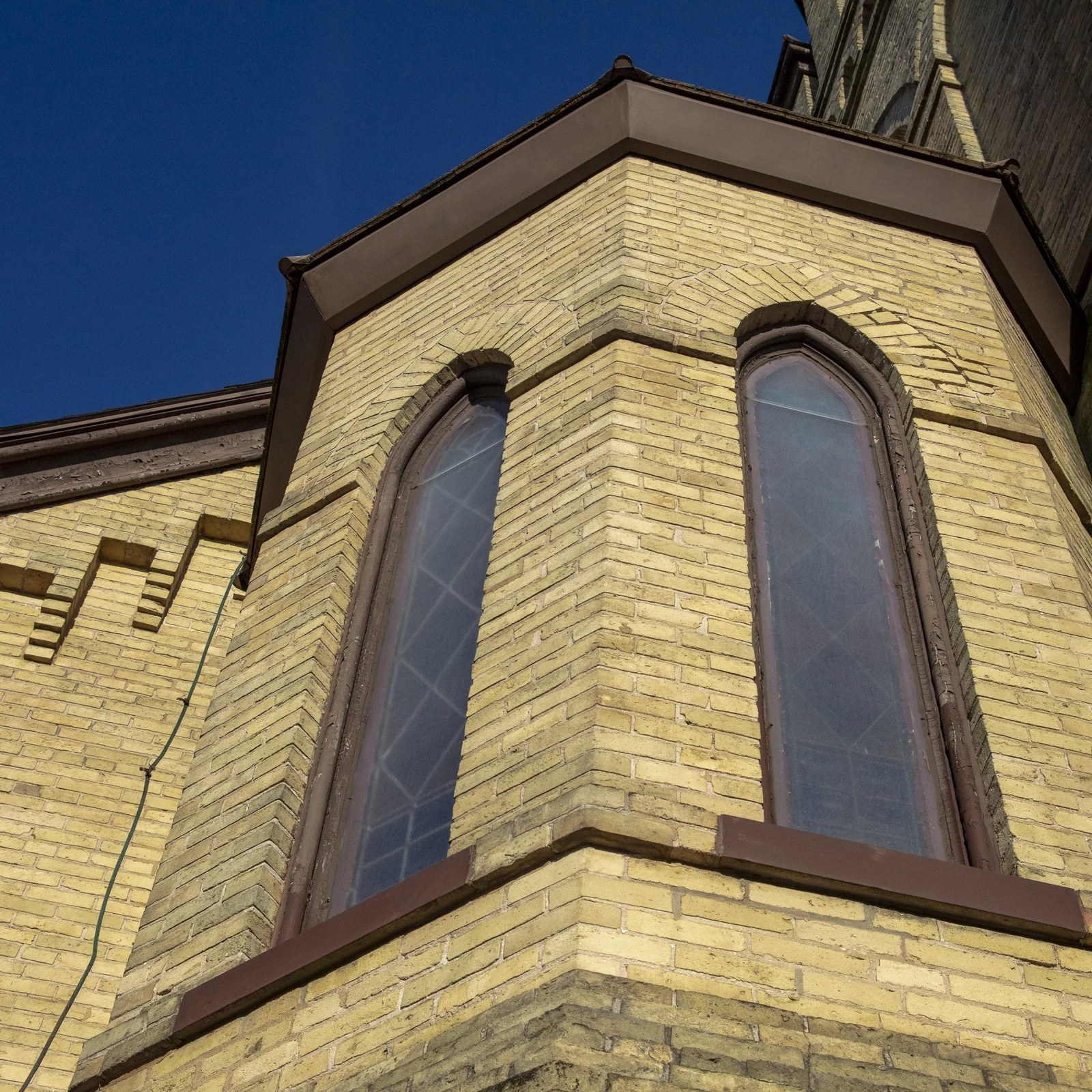Gothic windows and stonework on the City Tabernacle exterior
