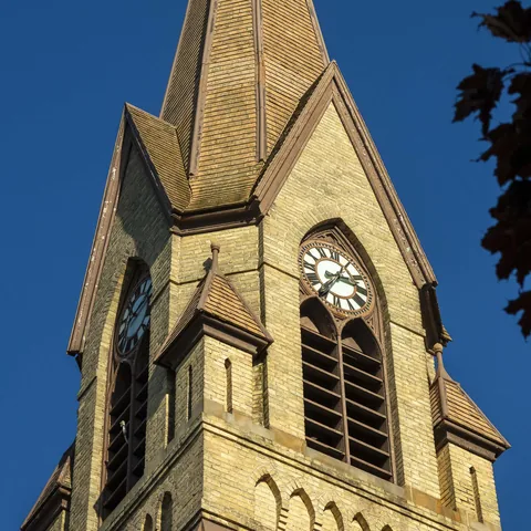 Clock face and Gothic arches on the church tower