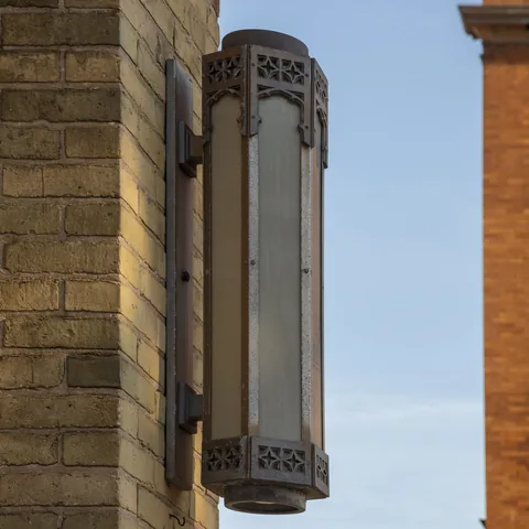 Decorative entrance lantern against brickwork