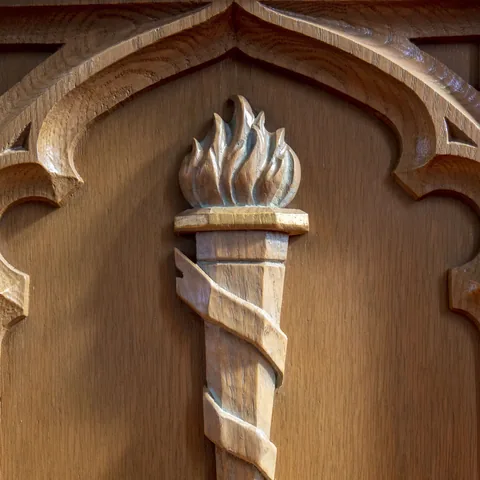Carved wooden torch detail